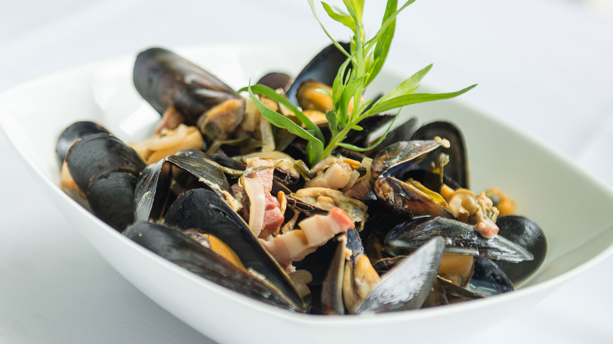 plated double smoked bacon and tarragon mussels