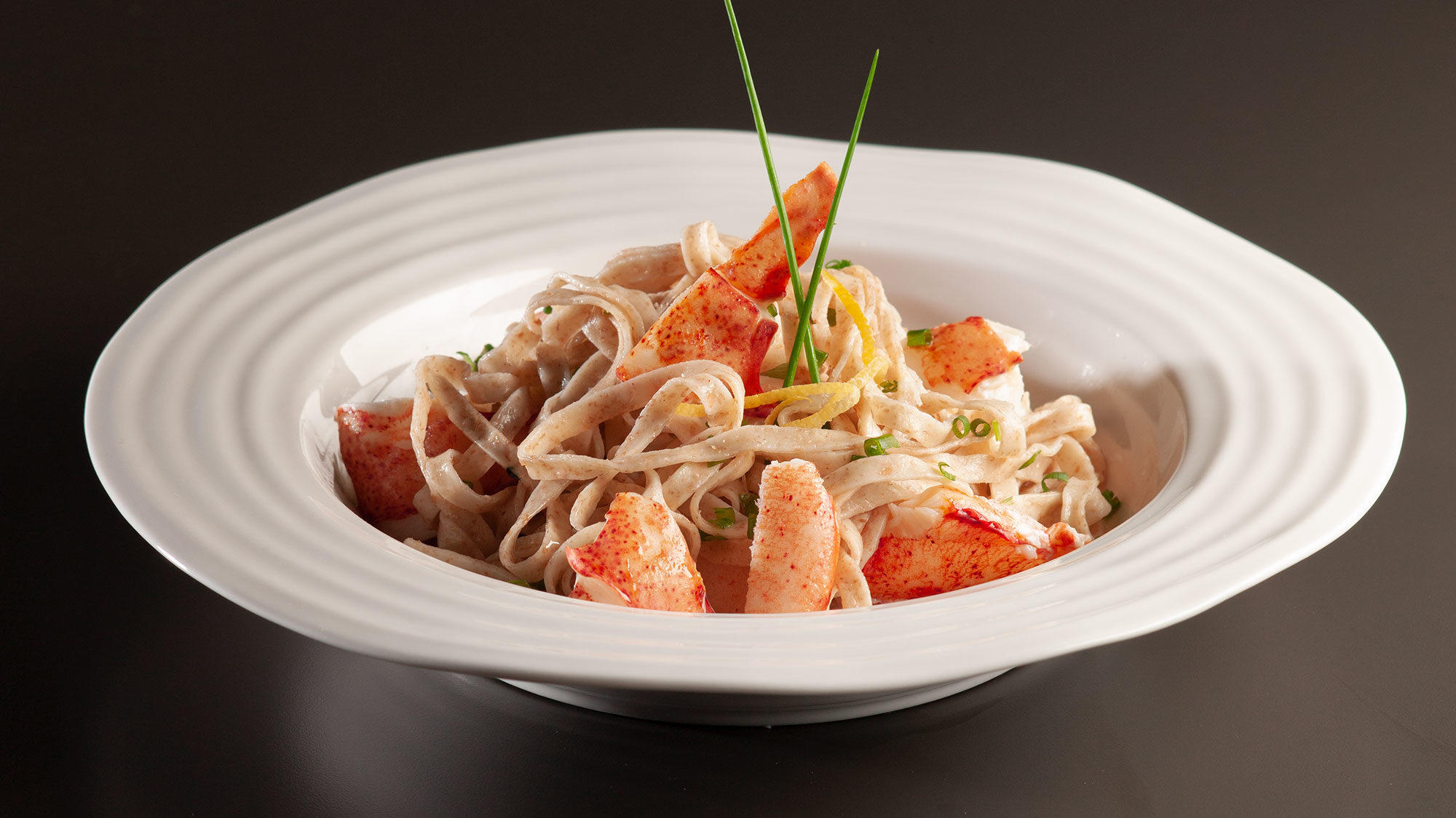 a bowl of prepared lobster pasta