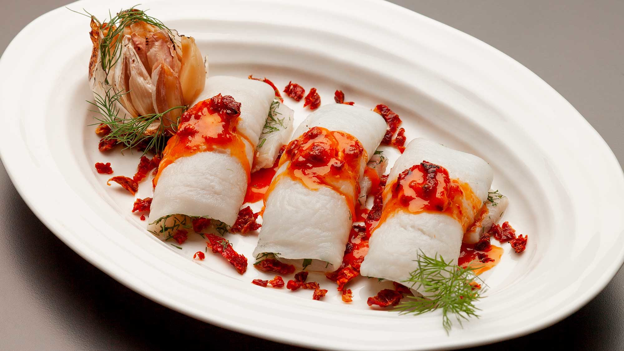 plated oven roasted flounder with tomato herb butter