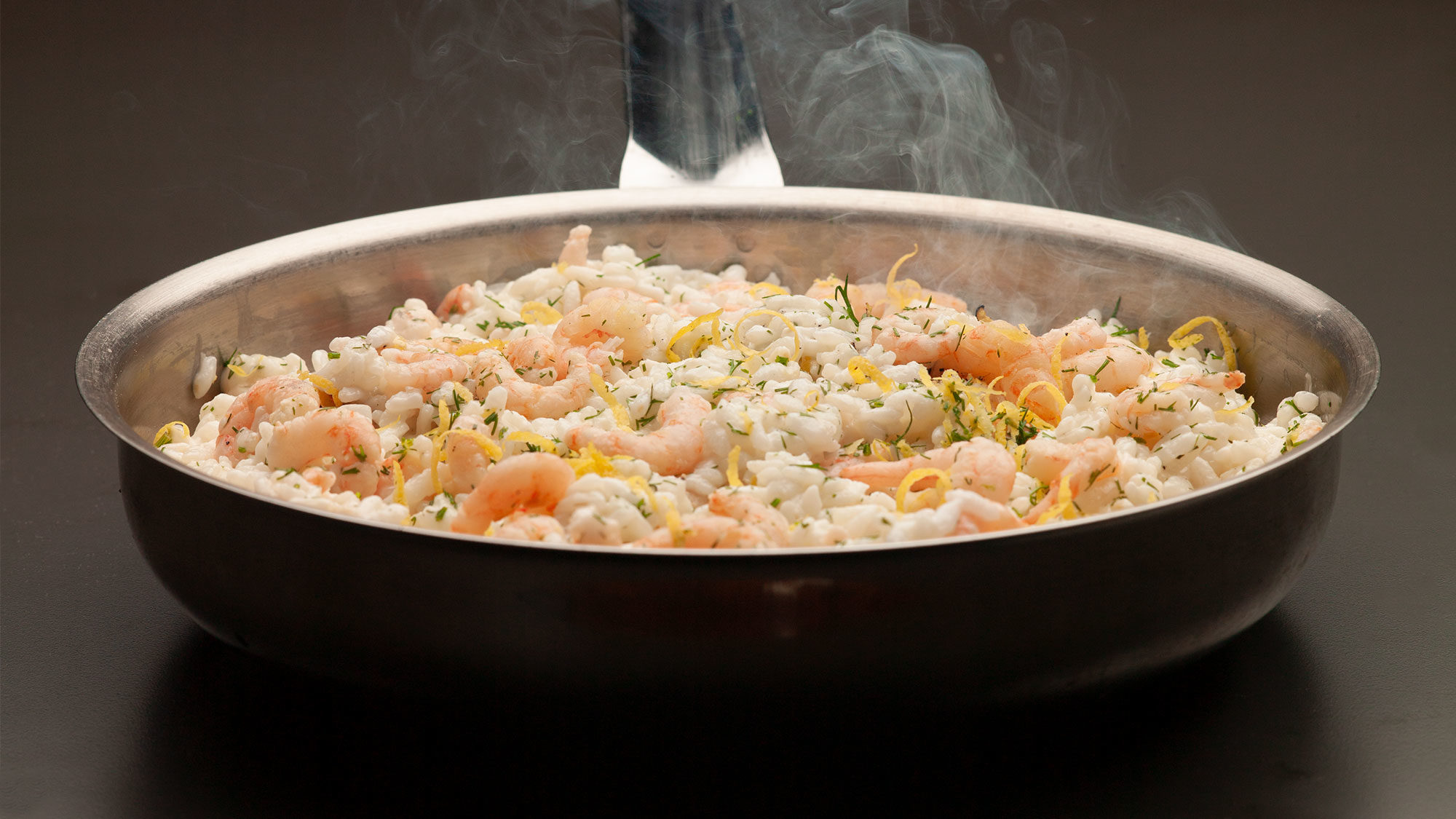 fresh coldwater shrimp risotto in a frying pan