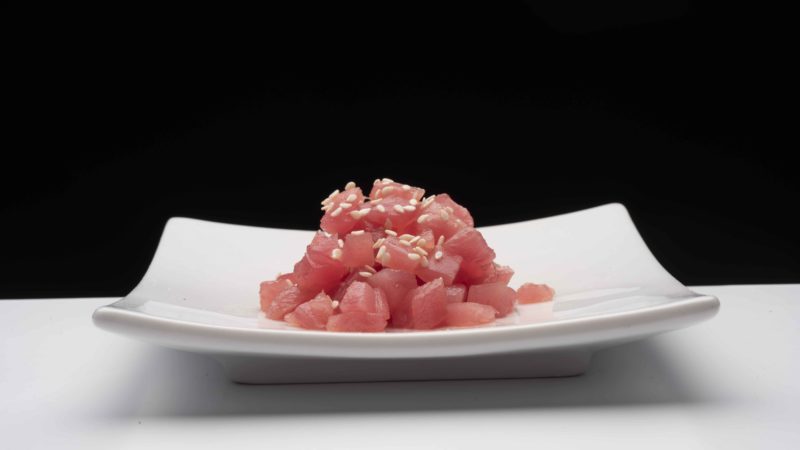 a small plate of cubed raw tuna